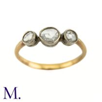 An Antique 3-Stone Rose Diamond Ring The 18ct yellow gold band is set with three bright rose