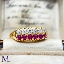 An Antique Ruby and Diamond Ring. The 18ct yellow gold ring is set with a row of six rubies and