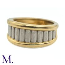 A Two-Colour Gold Ring by Cartier The two-colour fluted gold ring is by Cartier Paris. The band is