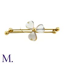 An Antique Moonstone Shamrock Brooch The 9ct yellow gold bar brooch is set with moonstones in a