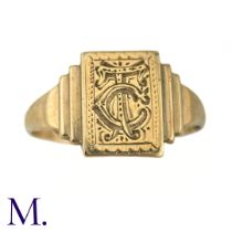 An Art Deco Engraved Signet Ring The 9ct yellow gold ring has a rectangular face with engraved