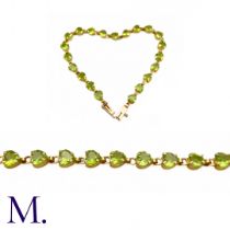 Vintage Peridot and Gold Bracelet (10ct Gold) The 10ct yellow gold bracelet is made up of twenty-one
