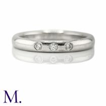 A Diamond Accent Ring by Tiffany & Co. The platinum band by Tiffany & Co. is set with three small