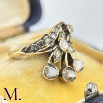 An Antique Rose Diamond Spray Ring The yellow gold band is set with a floral spray set with rose