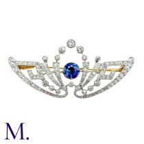 A Belle Epoque Sapphire and Diamond Brooch The brooch is set with a round cut sapphire of