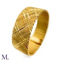 A Gold Woven Bracelet by Georges Lenfant. The 18ct yellow gold bracelet in woven and striated
