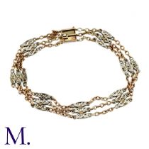 A Two-Colour Gold Bracelet The two-colour gold bracelet tests as 9ct gold. It is secured with a flat