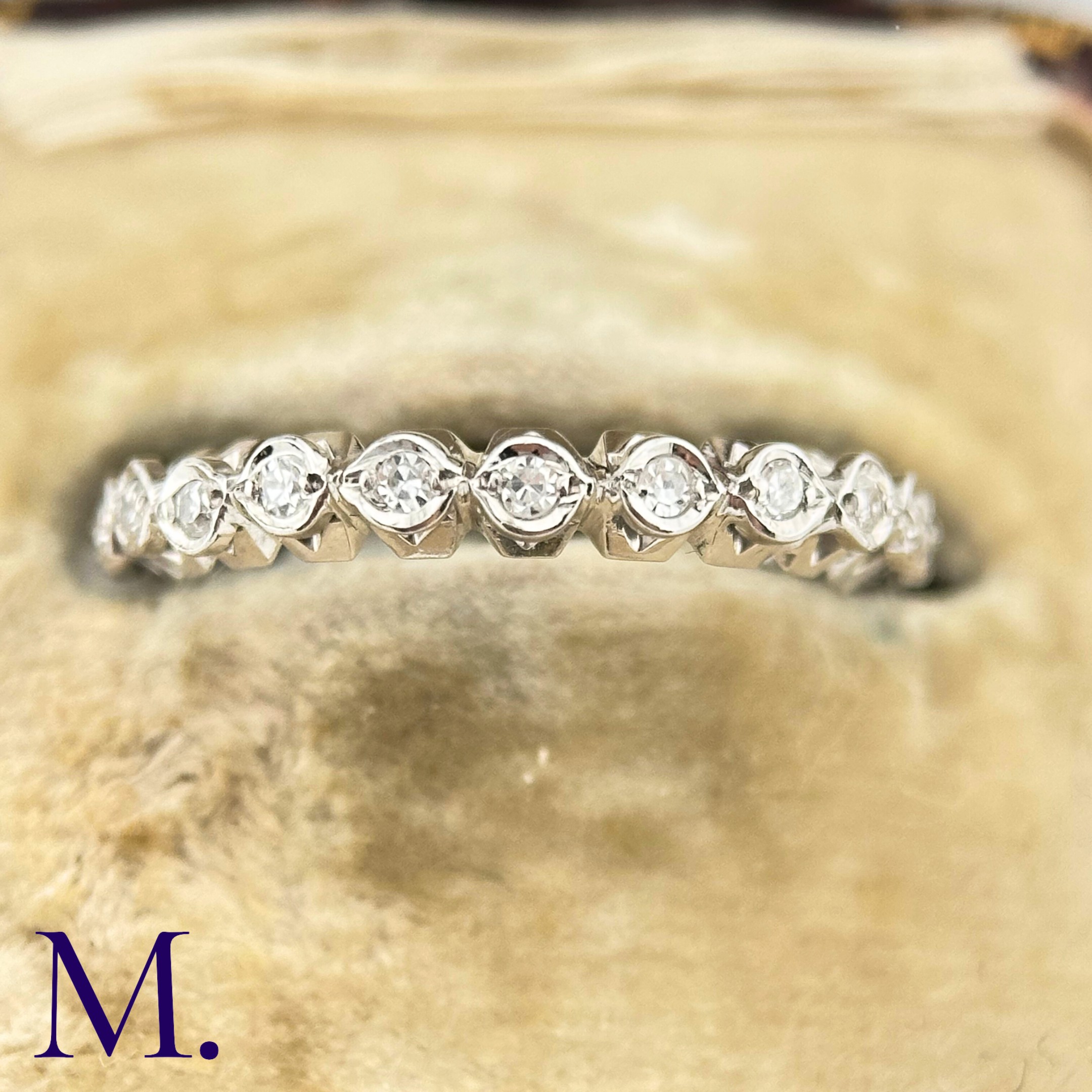 A Diamond Eternity Band The 18ct white gold band is set with approximately 0.65ct of round cut - Image 3 of 4