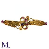 A Ruby and Diamond Brooch The Victorian-era brooch is set with rubies and diamonds. Weight: 2.4g