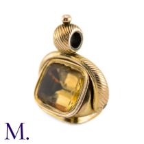 An Antique Triple Spinning Fob The large yellow metal triple spinning fob is set with a citrine,