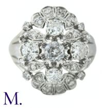 A Diamond Oval Cluster Ring The 18ct white gold ring is set with a cluster of diamonds, the centre