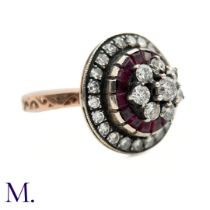An Antique Ruby and Diamond Cluster Ring. The antique ruby and diamond ring is set with a cluster of