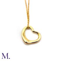 An Open Heart Pendant with Chain by Tiffany & Co. The 18ct yellow gold pendant (16mm version) is