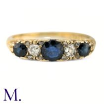 An Antique Sapphire and Diamond 5-Stone Ring The antique 18ct yellow gold carved band is set with