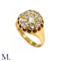 A Victorian Diamond Cluster Ring. The antique 18ct yellow gold ring is set with nine old cut