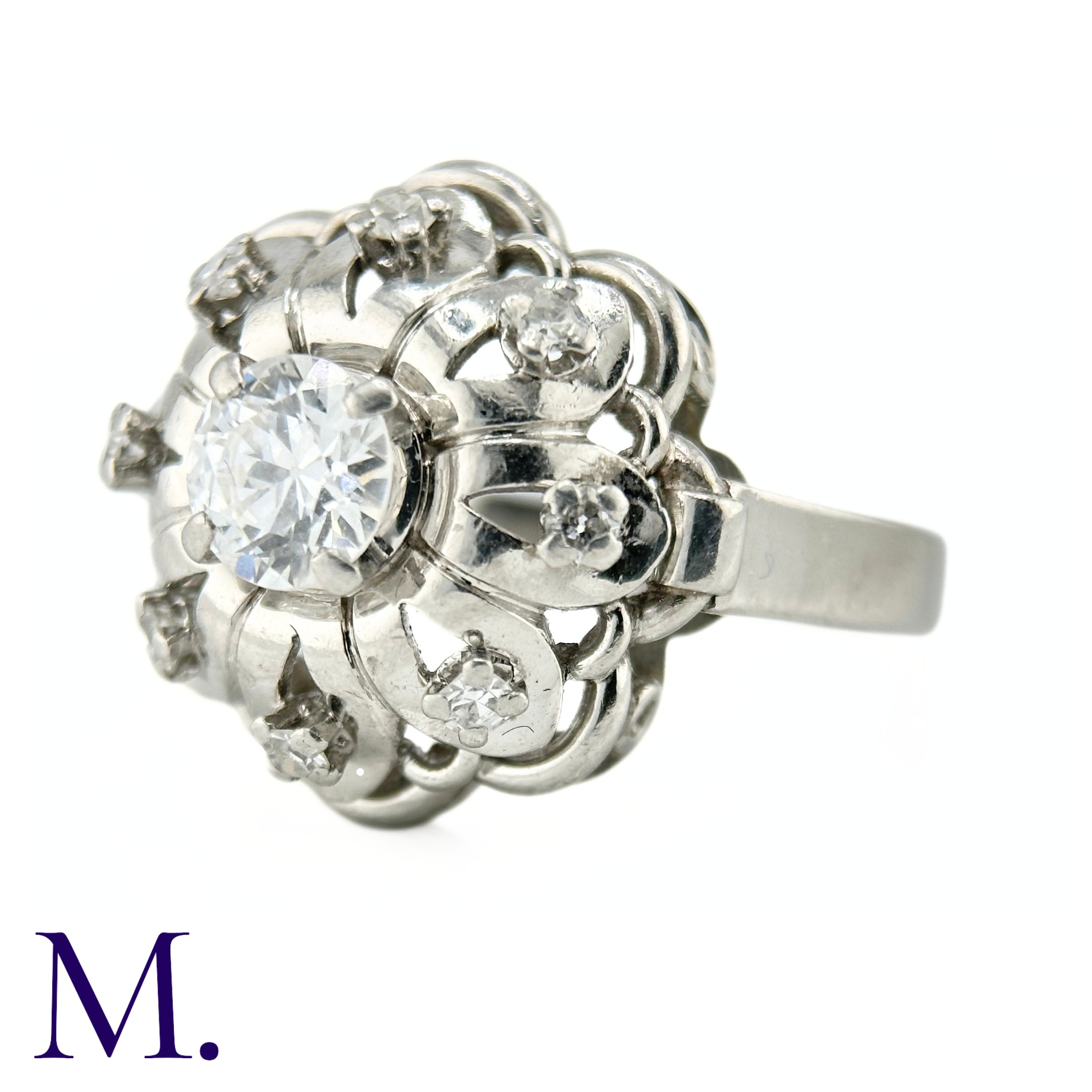 A French Diamond Cluster Ring The French ring is set with a round cut diamond to the centre of