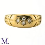 An Antique Diamond Gypsy Ring The antique 18ct yellow gold ring is set with four small diamonds.
