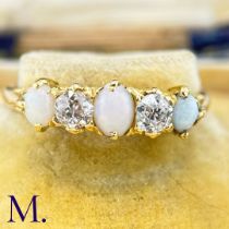 An Antique Opal and Diamond Ring The 18ct yellow gold ring is set with three oval opals with good