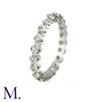 A Diamond Eternity Band The 18ct white gold band is set with approximately 0.65ct of round cut