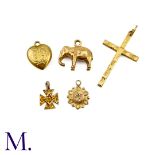 Five 9ct Gold Charms The lot includes various charms including a heart, a cross, an elephant and two