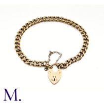 An Antique Rose Gold Curb Bracelet The 9ct rose gold bracelet is secured with a heart padlock and