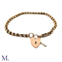 An Antique 9ct Gold Fancy Link Bracelet. The 9ct rose gold bracelet is secured with a heart-shaped