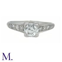A Diamond Solitaire Ring The solitaire ring is set with a bright 0.40ct transitional cut diamond.