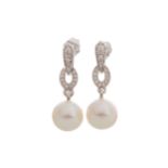 PAIR OF PEARL AN DIAMOND EARRINGS