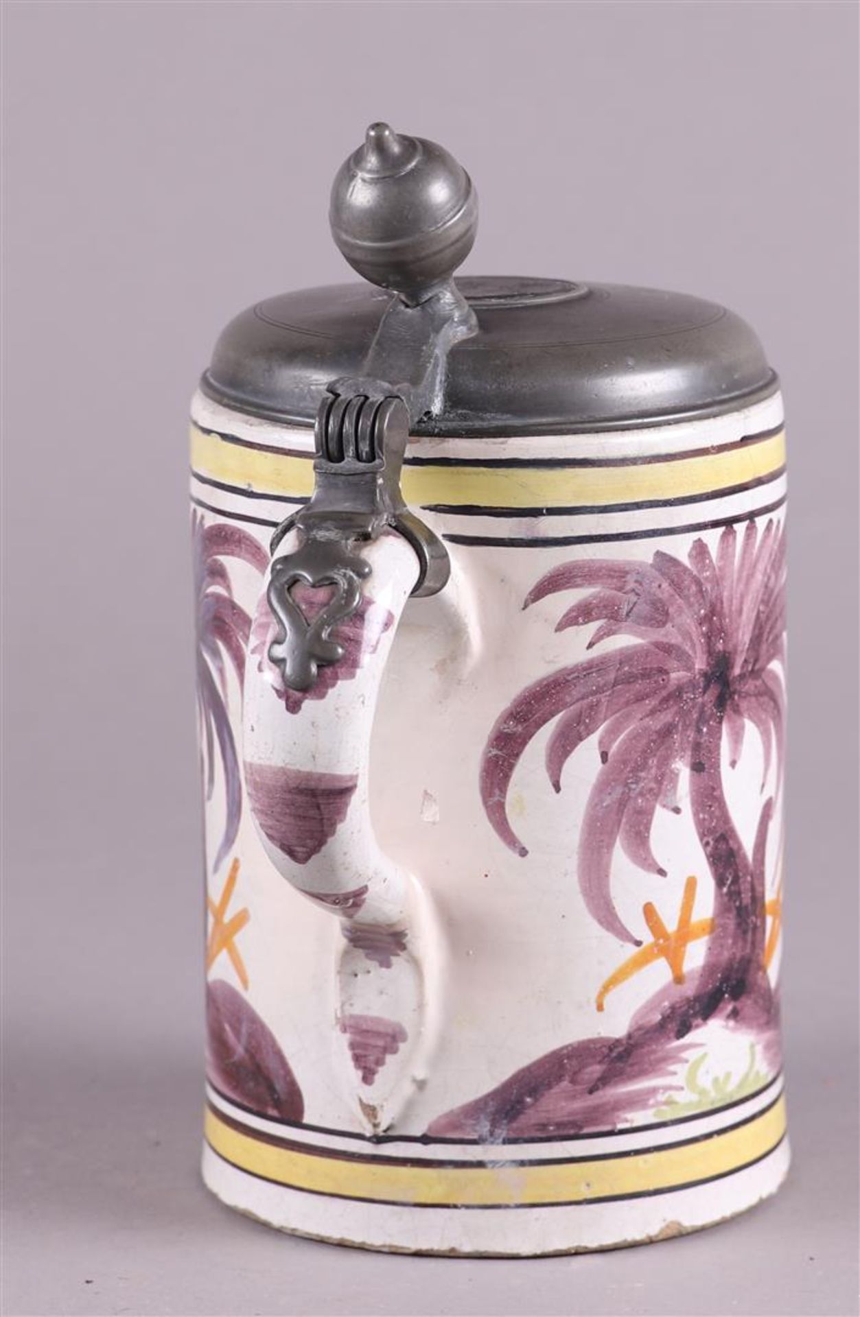 An earthenware beer jug with a polychrome decor of a rearing horse, with a pewter lid. - Image 3 of 5