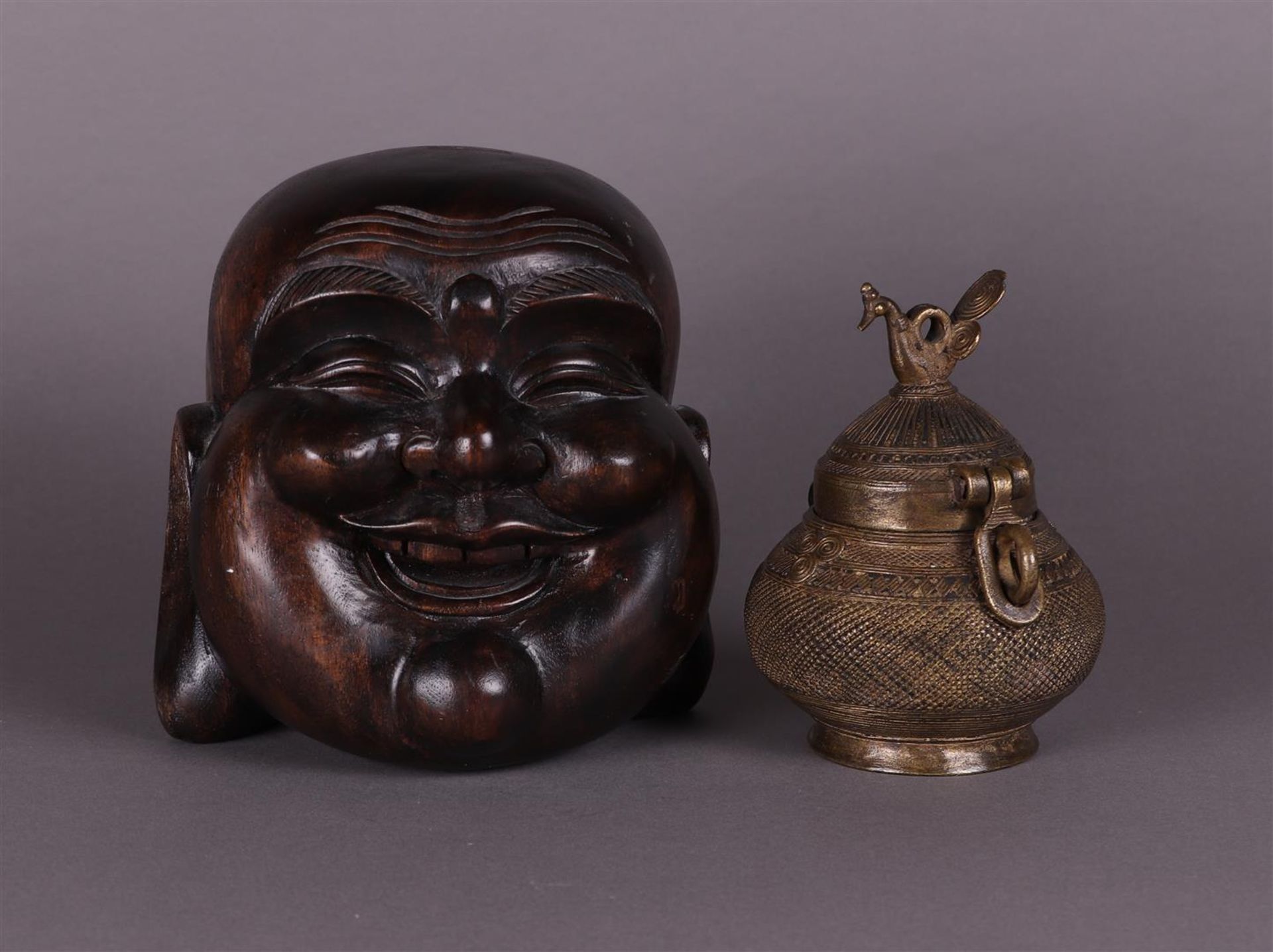 A bronze jar lidded with,. with a hardwood sculpture of a Happy Buddha
