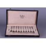 A set of 10 silver cake forks in original box.
