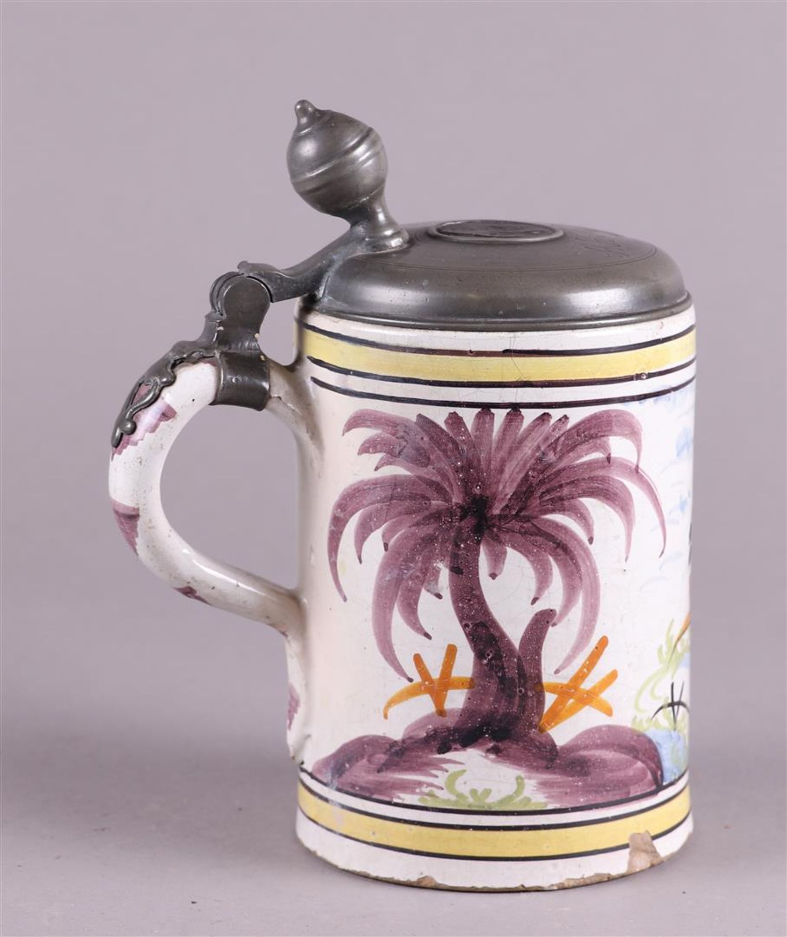 An earthenware beer jug with a polychrome decor of a rearing horse, with a pewter lid. - Image 2 of 5