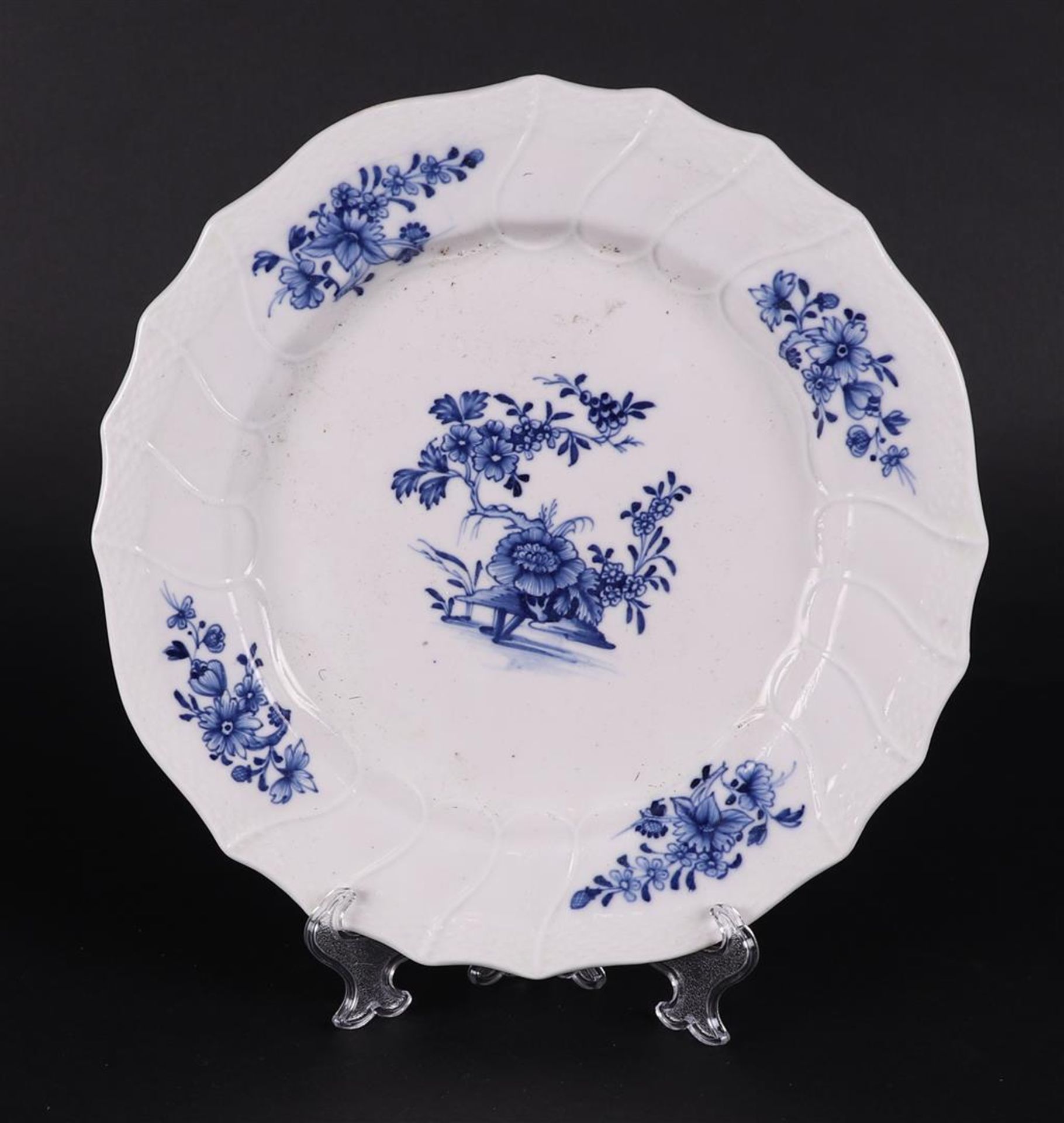 A porcelain plate decorated with flowers. Tournai, 18th century.