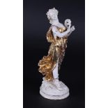 A porcelain partly gilded female figure with a stage mask, marked Dressel, Kister & Cie.
