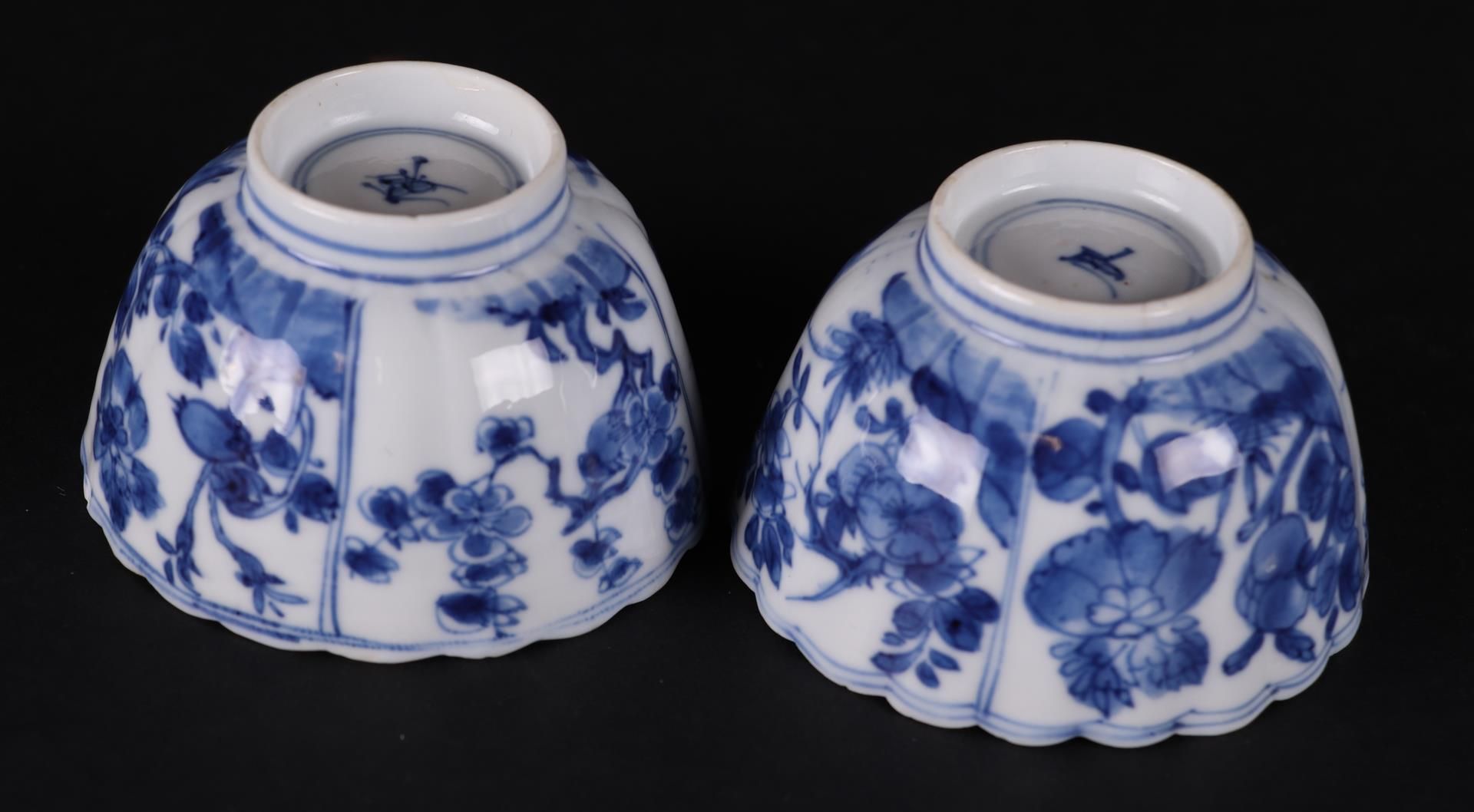 Two ribbed porcelain bowls with rich floral decoration in borders, both marked on the bottom. - Image 3 of 3