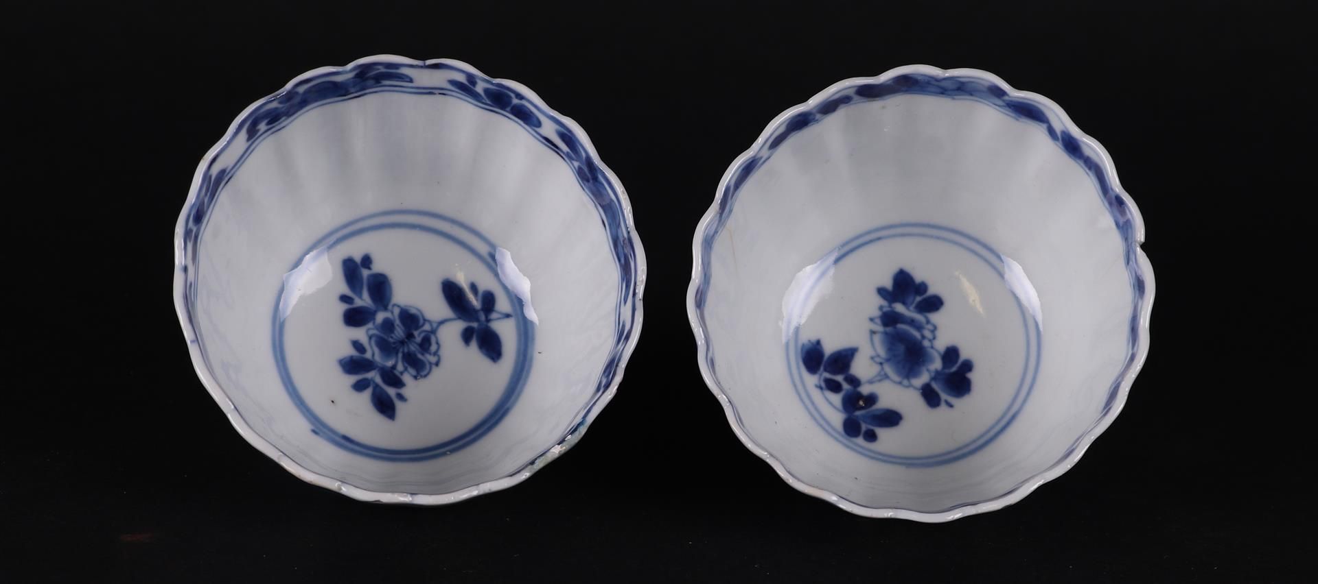 Two ribbed porcelain bowls with rich floral decoration in borders, both marked on the bottom. - Image 2 of 3