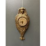 A bronze, Empire-style cartel clock with enamel numerals, movement checked and in working order.