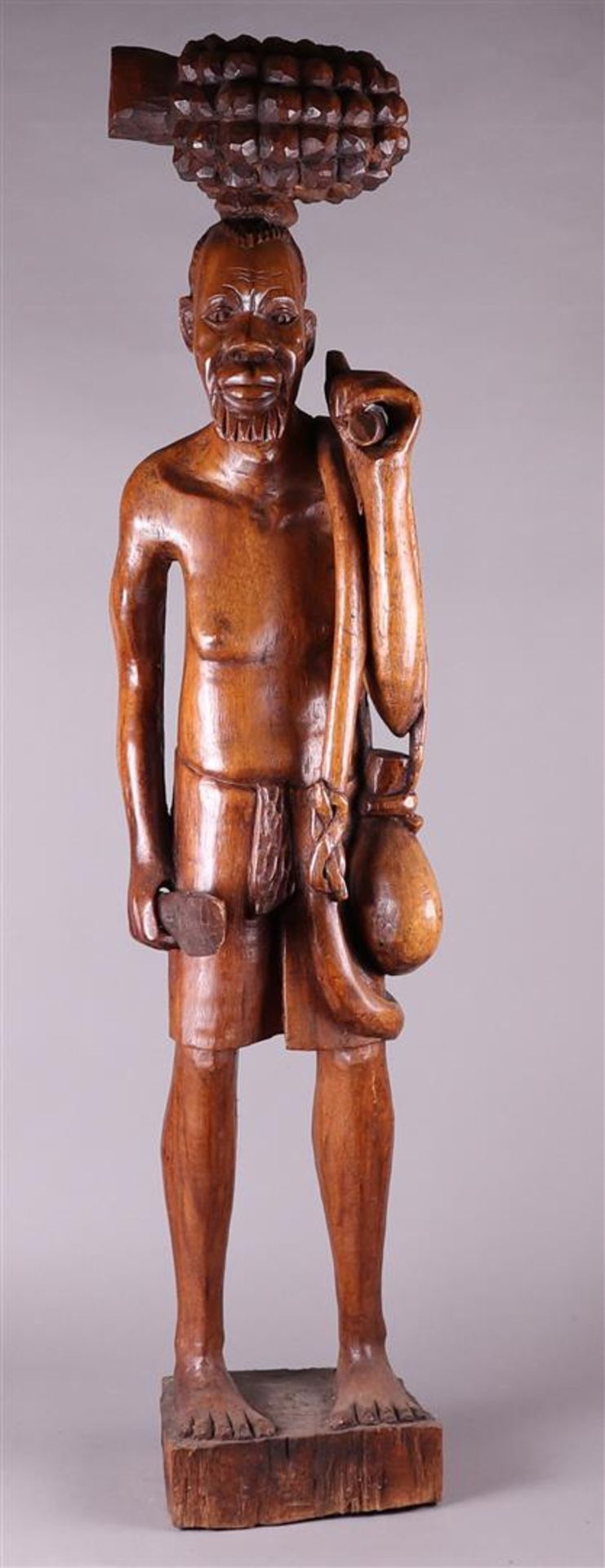 A large wooden statue of a hunter. Africa, 20th century.