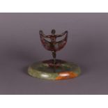 A cold-painted erotic "Viennese" bronze of a belly dancer on a marble dish (vide poche).