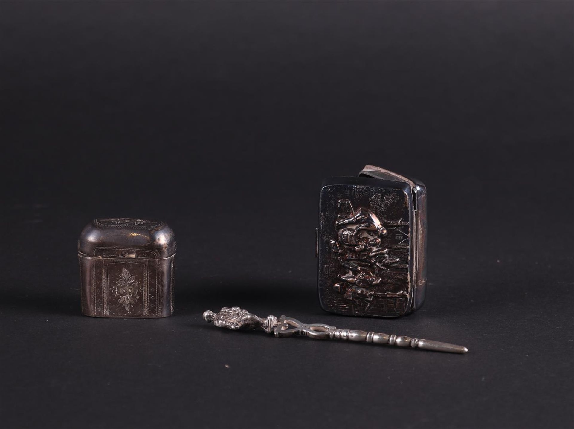 Two silver boxes (loderein and pills) and a silver pipe scraper. 2nd grade.