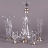 A lot with crystal vases, carafes of glasses on a silver base.