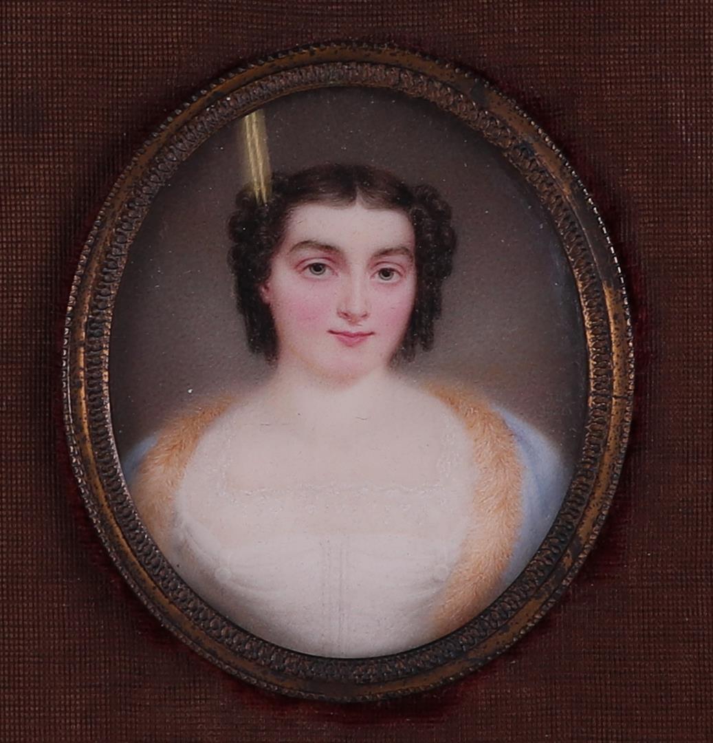 A hand-painted miniature portrait of a young lady. Approx. 1815.