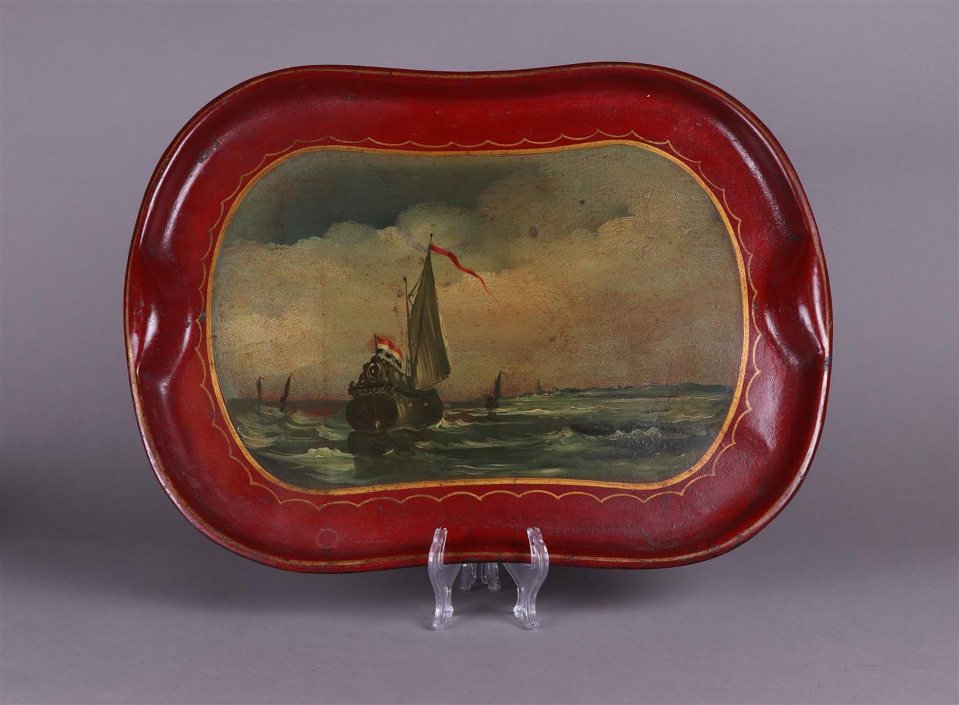 A 19th century metal tray depicting ships off the coast of Zeeland. 