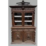 A Dutch, oak so-called hunting cabinet, base with two doors, curb with two richly carved doors