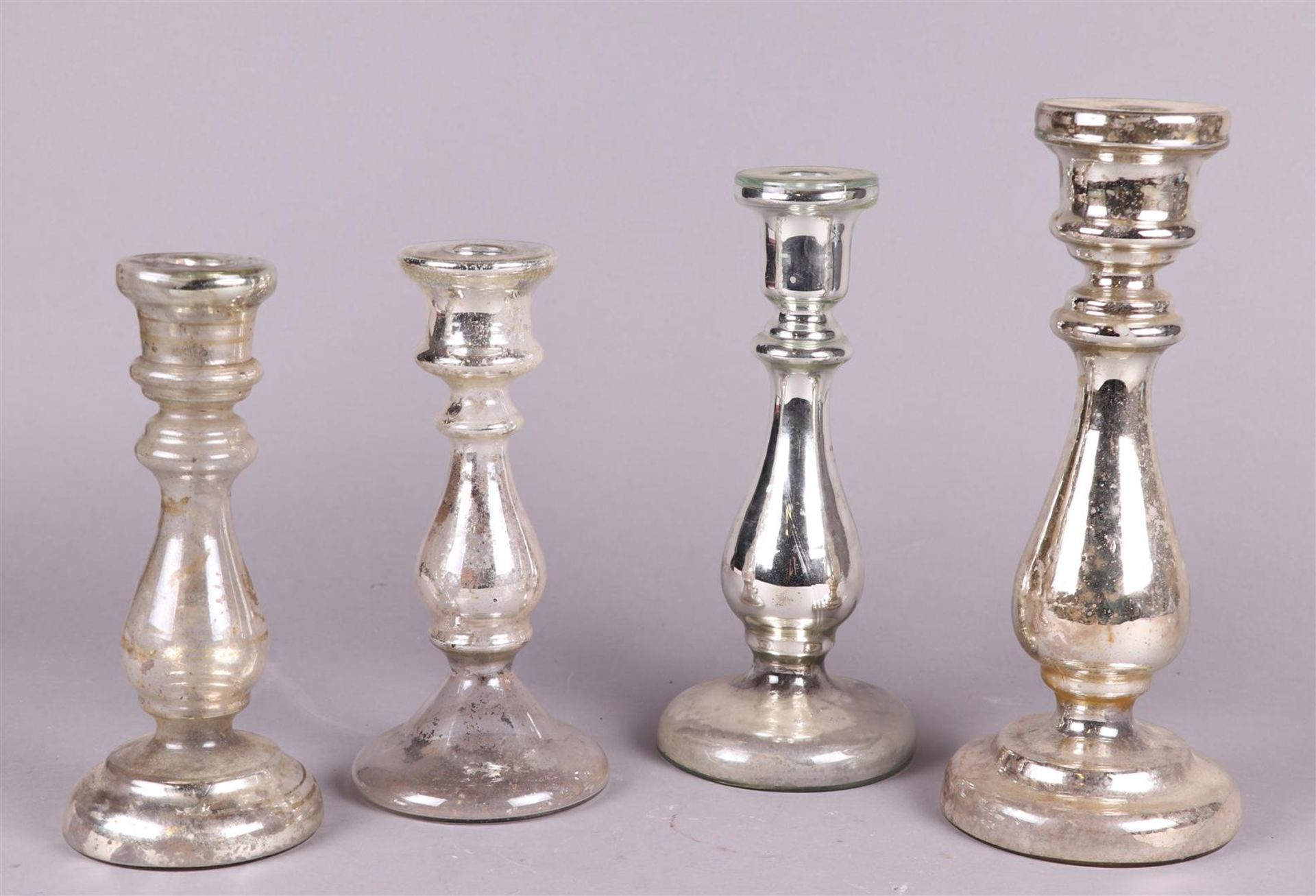 A lot of (4) glass silver-plated candlesticks. France, late 19th century.