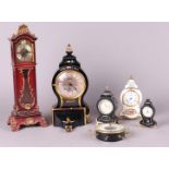 A lot with various miniature clocks. Late 20th century.