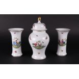 A porcelain 3-piece garniture with roosters and chickens decor with butterflies. Herend