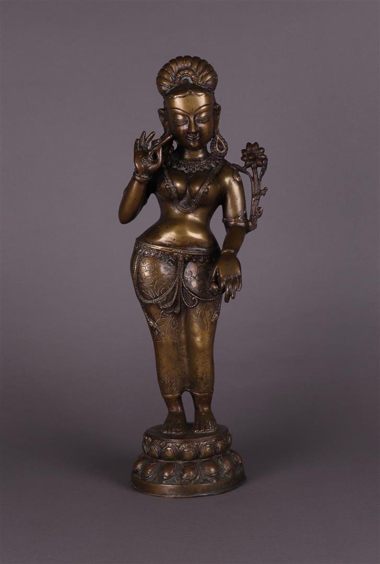 A bronze figure of a standing Tara. Tibet, 20th century.