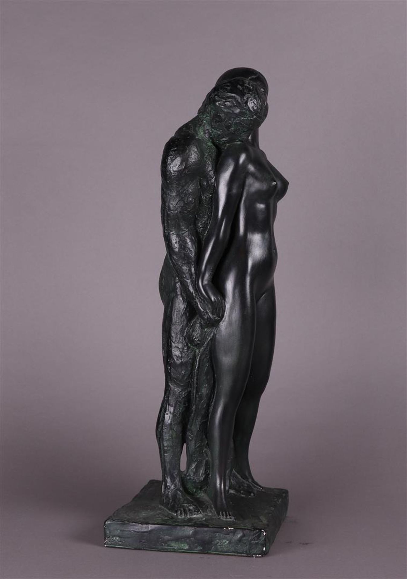 A patinated plaster sculpture of a man and woman in an embrace.  - Image 2 of 4