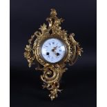 A Louis XV style cartel clock with enamel dial, ca. 1890. Movement tested and in working order.